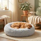 Dog curled up sleeping in CalmPaws donut bed